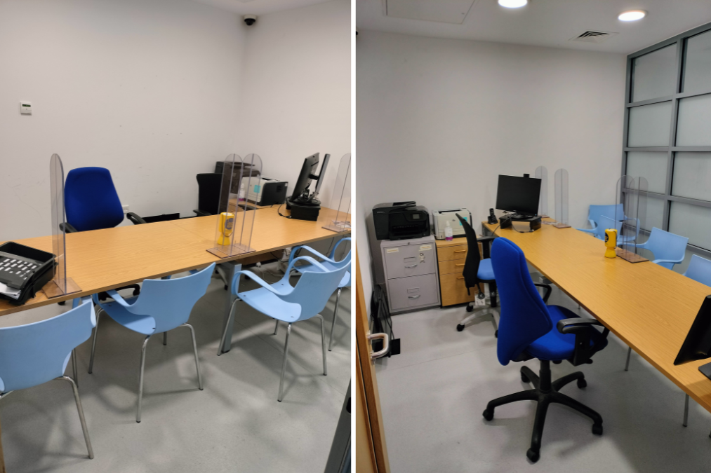 Two views of an office space with wooden tables, blue and light blue chairs, transparent dividers, office supplies, and equipment like a phone, monitor, and printer.