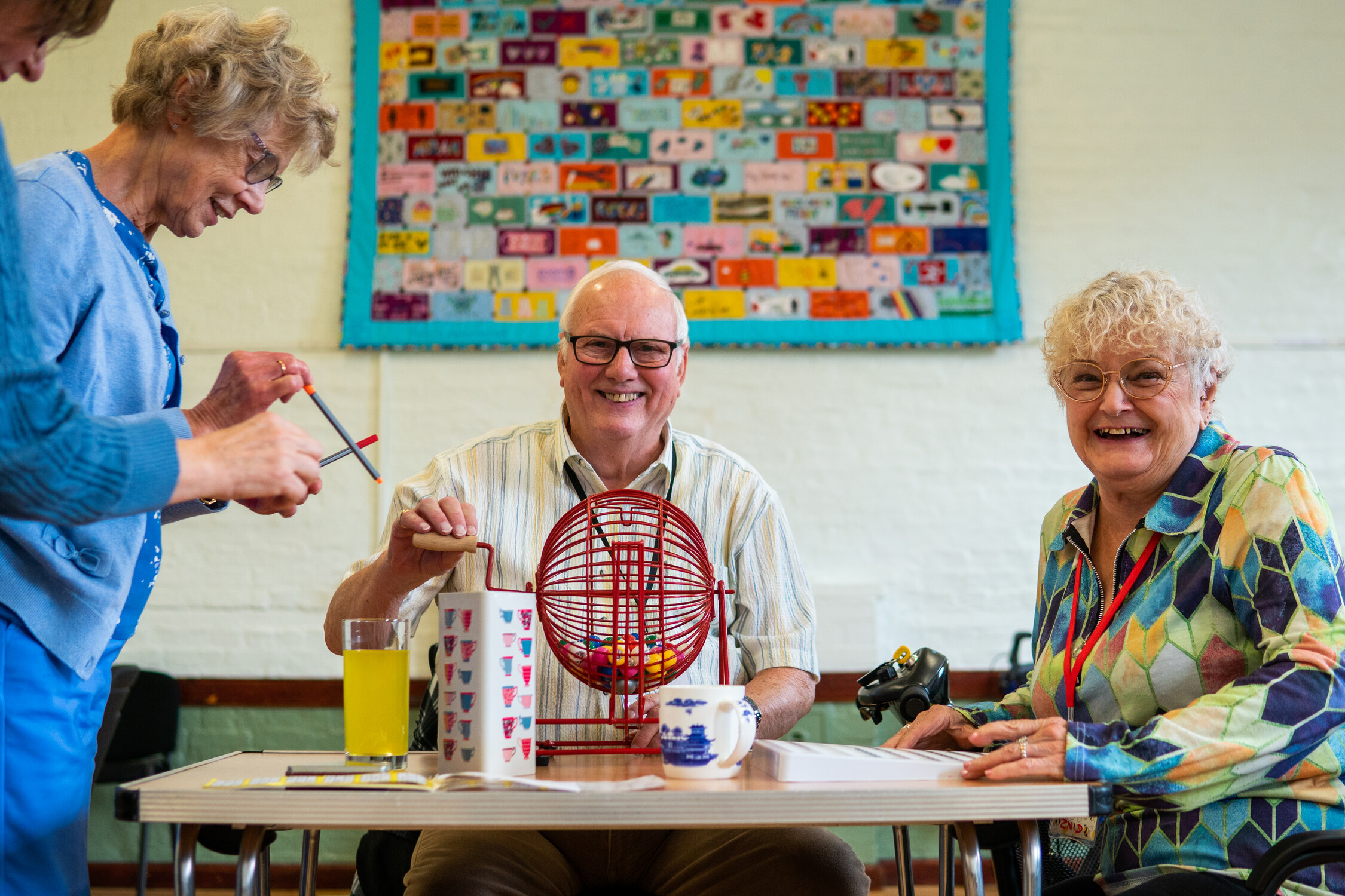 Older people at a social club playing table top games