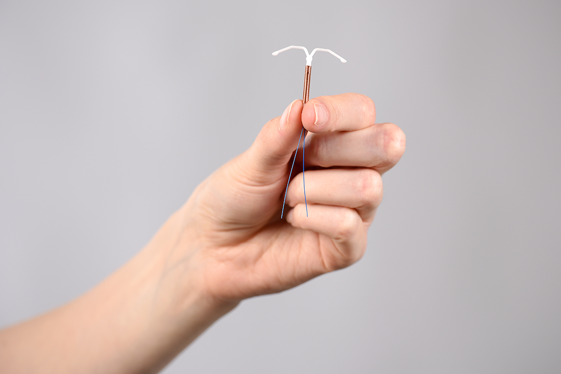 Someone holding a copper coil