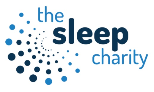 The logo of "The Sleep Charity." To the left of the text, there is a spiral pattern made up of variously sized dots in shades of blue, ranging from light to dark