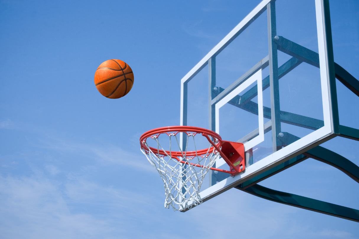 basketball A basketball flying into a basketball hoop.