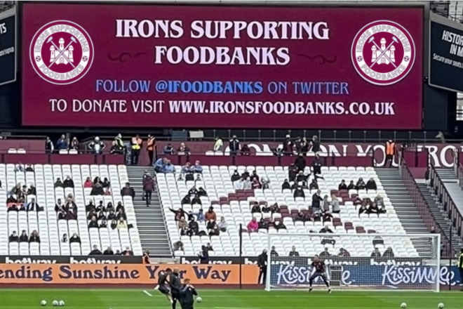 West Ham Football Stadium bleachers with an 'Irons Supporting Foodbanks' billboard on top.