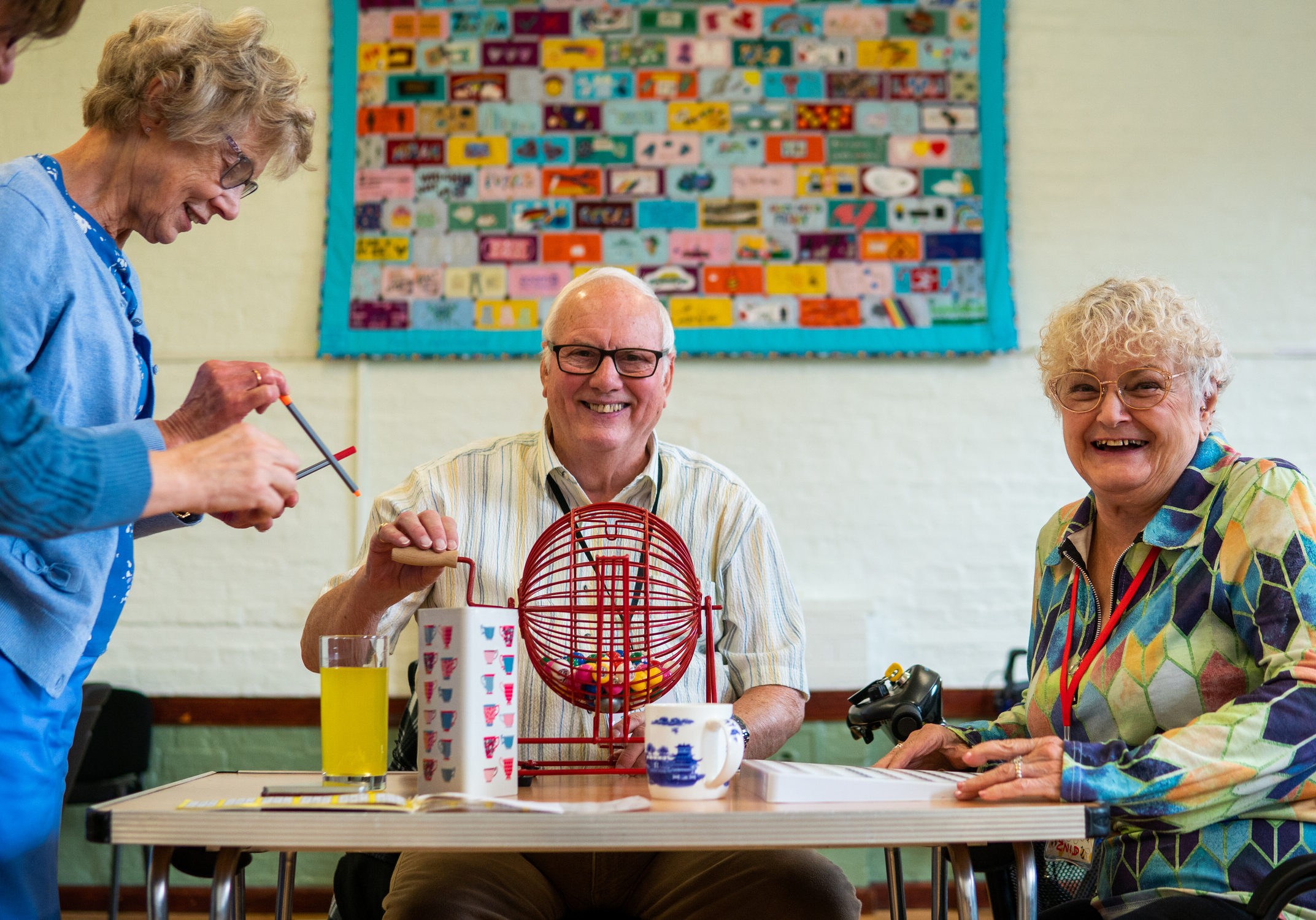 Older people at a social club playing table top games